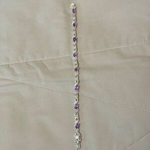 Silver tone bracelet amethyst colored stones & small clear rhinestones.